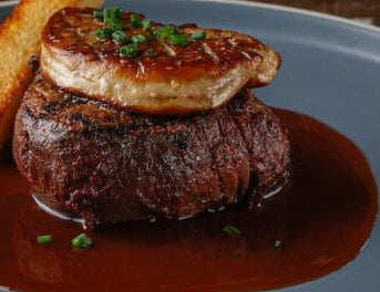 'Filet Mignon Rossini' Pan Roasted Angus Beef Tenderloin with Pan-Seared Foie Gras Celeriac Mash, Red Wine & Truffle Sauce