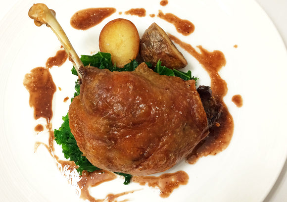 Duck Leg Confit with Baby Potatoes, French Beans, Garlic Confit & Brown Jus